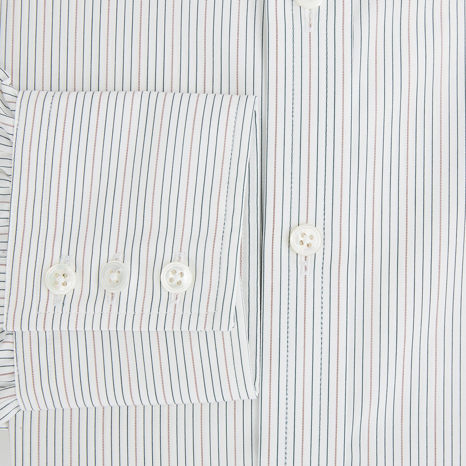View 4 of product The Petrol Hairline Stripe Mayfair Shirt by Turnbull & Asser is a long-sleeved, button-up Italian cotton shirt with a subtle blue pinstripe, classic T&A collar, and buttoned cuffs, shown flat on a white background.