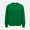 View 1 of product The Turnbull & Asser Grass Green Cashmere Round Neck Jumper features long sleeves, ribbed cuffs, collar, and hem, shown on a white background.