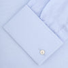View 4 of product A neatly folded Turnbull & Asser Two-Fold 120 Light Blue Shirt, featuring a regent collar and double cuffs, is displayed against a plain white background.