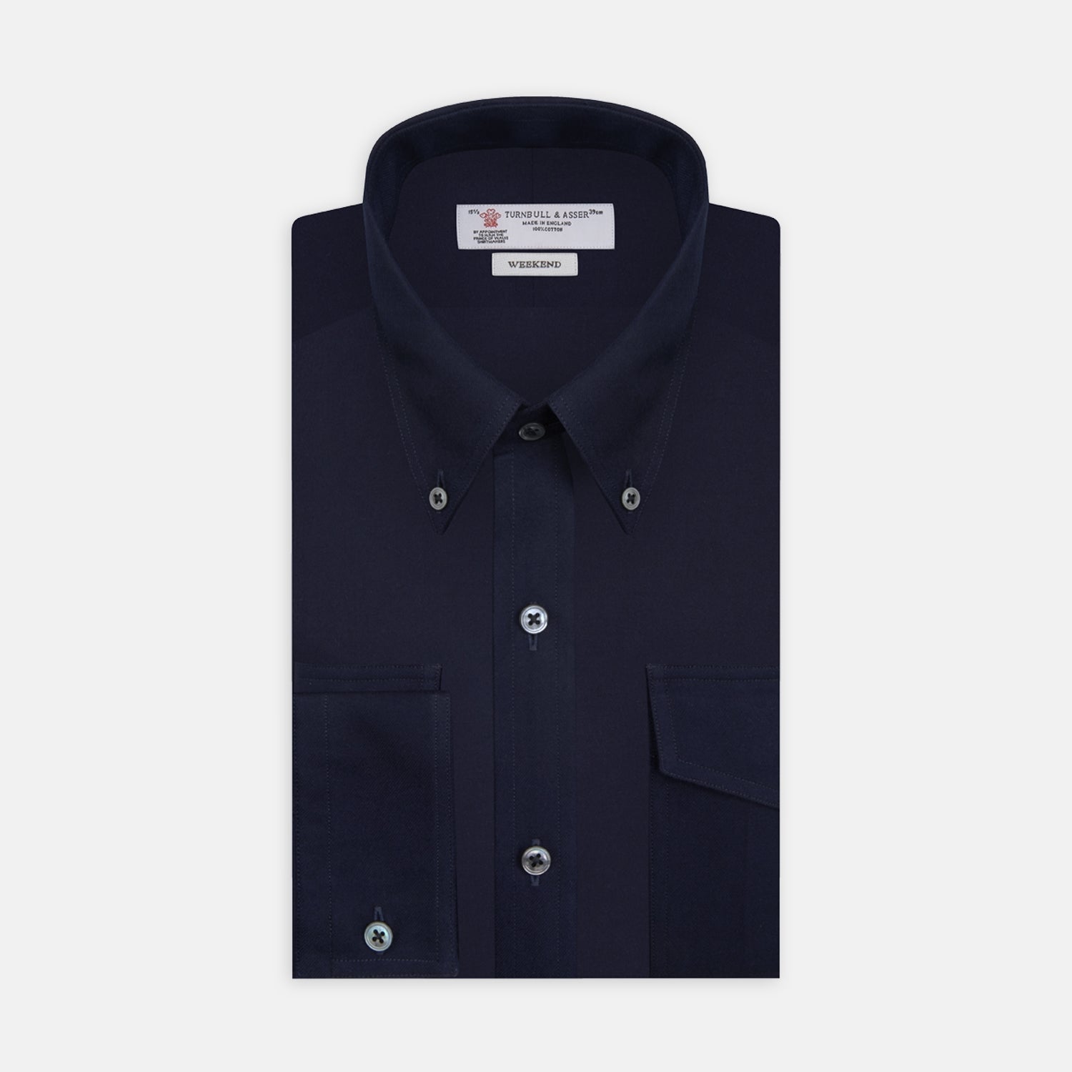 View 1 of product The Turnbull & Asser Navy Cashmere Cotton Shirt is a formal, dark navy blue shirt with a collar and front pocket, crafted from a luxurious cotton and cashmere blend, shown neatly folded against a white background.