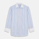 The Turnbull & Asser Light Blue Multi Stripe Cotton Regular Fit Penrose Shirt features light blue, white, and pink stripes with a crisp white collar and cuffs, displayed on a white background.