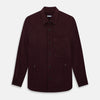 View 1 of product The Turnbull & Asser Burgundy Corduroy Hampstead Overshirt features long sleeves, a collar, a large left chest pocket, and two zippered side pockets, shown laid flat on a plain white background.