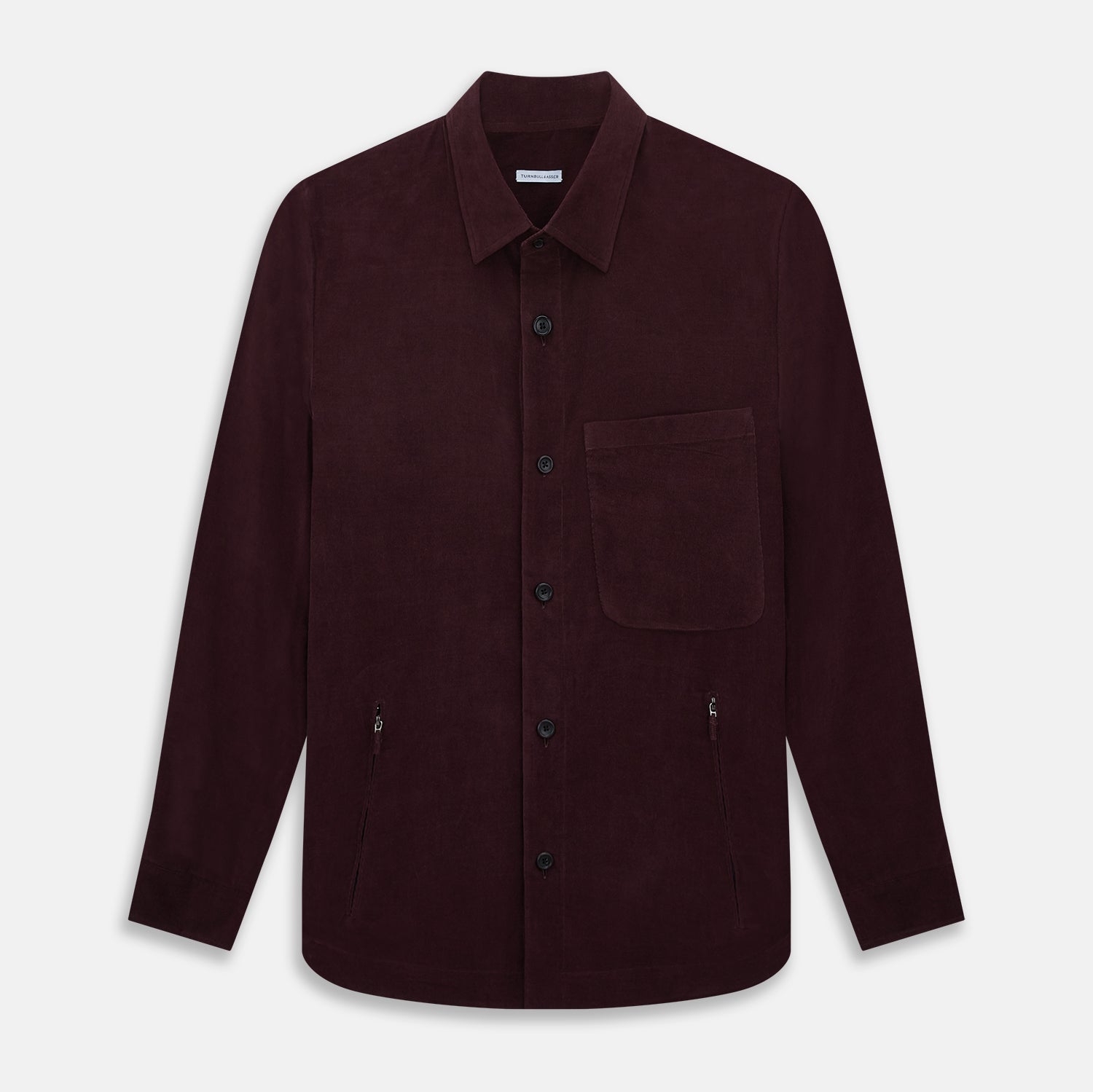 View 1 of product The Turnbull & Asser Burgundy Corduroy Hampstead Overshirt features long sleeves, a collar, a large left chest pocket, and two zippered side pockets, shown laid flat on a plain white background.