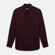 The Turnbull & Asser Burgundy Corduroy Hampstead Overshirt features long sleeves, a collar, a large left chest pocket, and two zippered side pockets, shown laid flat on a plain white background.