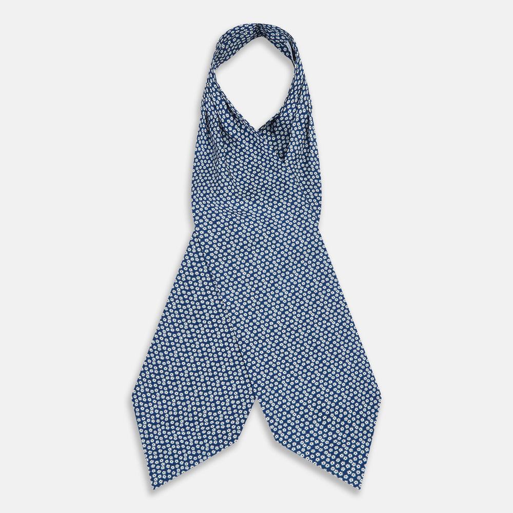 The Azzurro Flower Patterned Silk Cravat by Turnbull & Asser features a classic blue design with small white flowers—a refined British-inspired accessory.