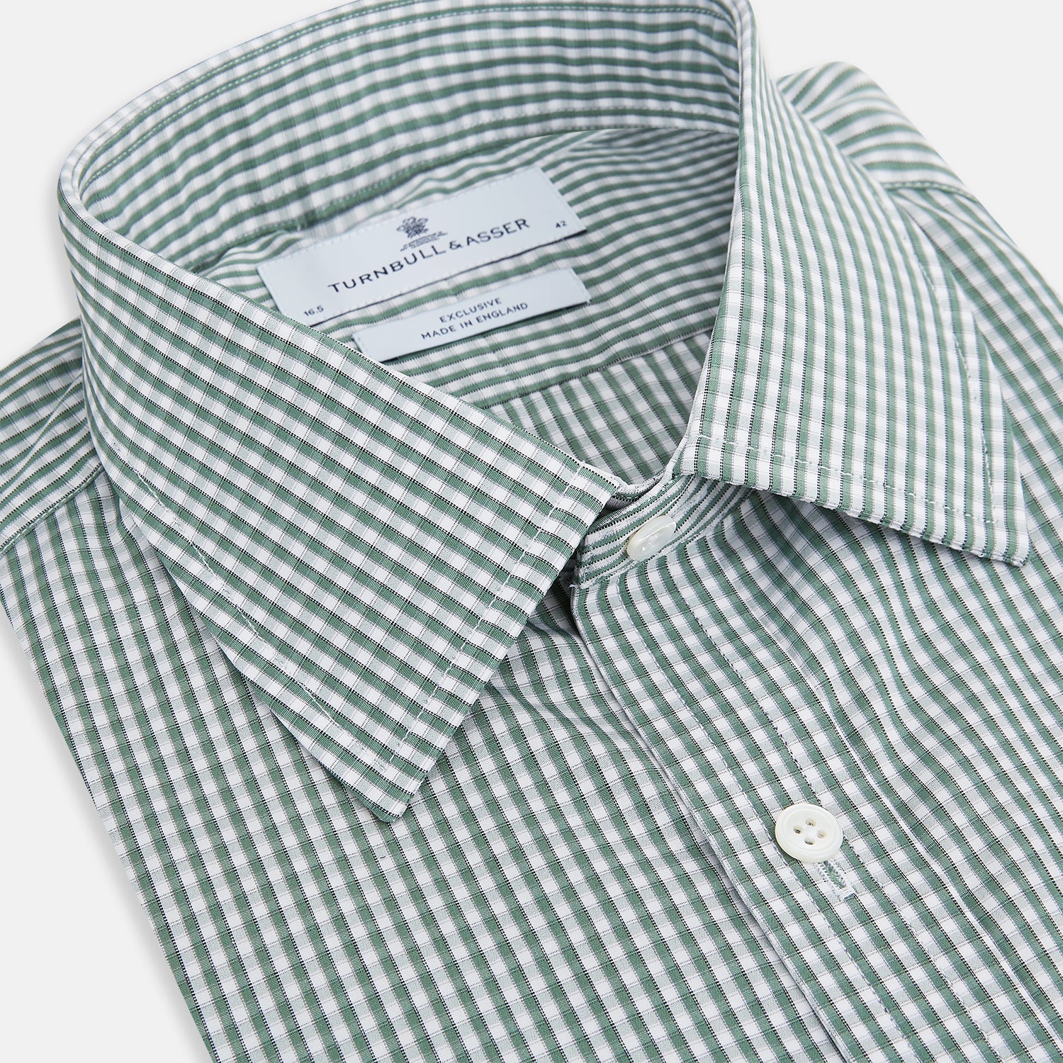 View 2 of product The Turnbull & Asser Green Fine Check Mayfair Shirt, crafted from fine Italian cotton with a pointed collar and buttoned cuffs, is shown laid flat on a white background.