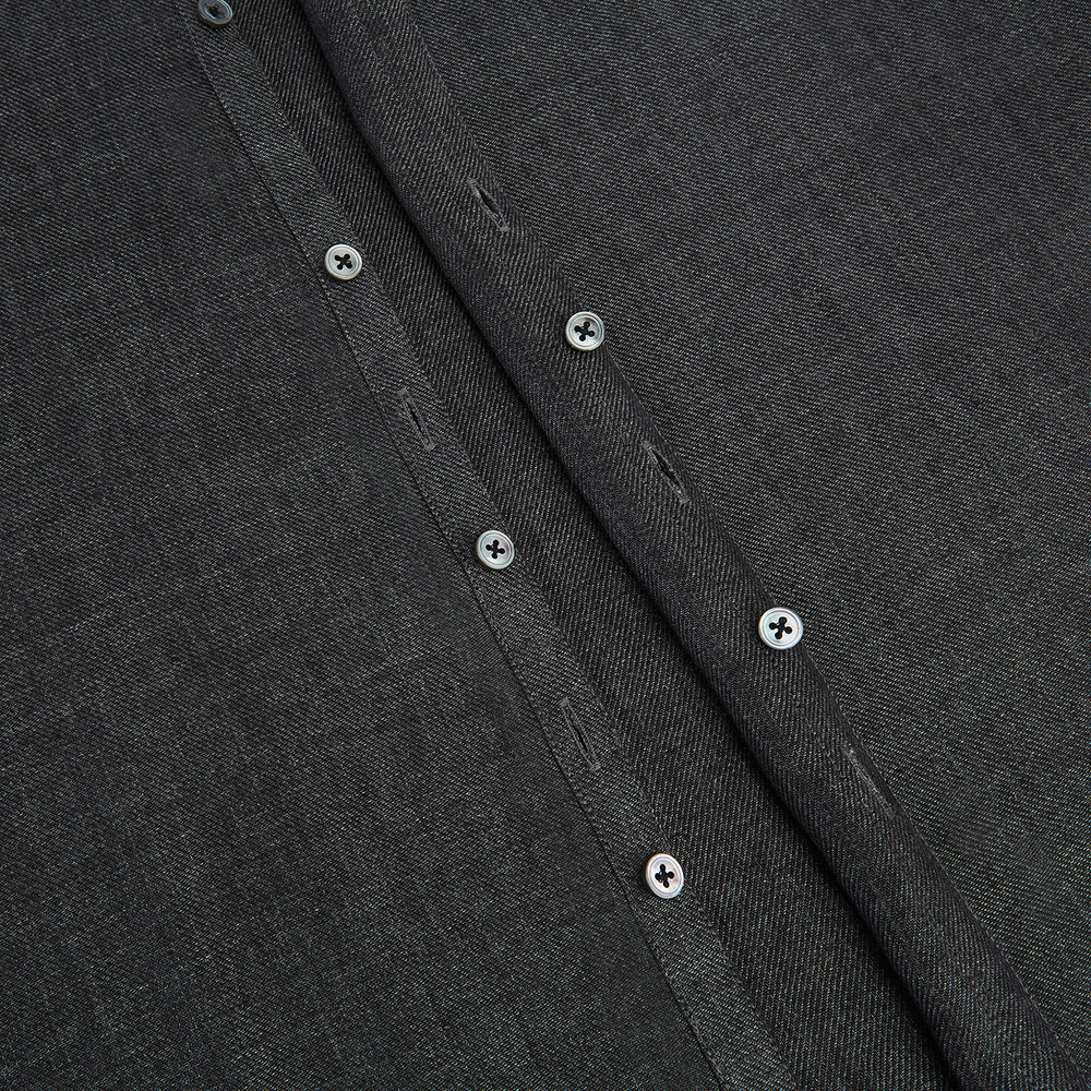 The Ash Linen Windsor Shirt by Turnbull & Asser is a long-sleeve, button-up black shirt with a Windsor collar and cuffs, reflecting British craftsmanship, shown on a plain white background.