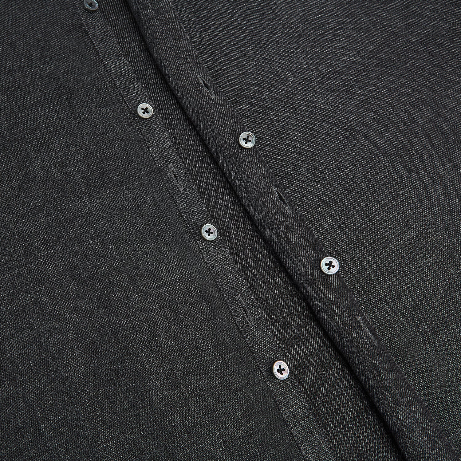 View 7 of product The Ash Linen Windsor Shirt by Turnbull & Asser is a long-sleeve, button-up black shirt with a Windsor collar and cuffs, reflecting British craftsmanship, shown on a plain white background.