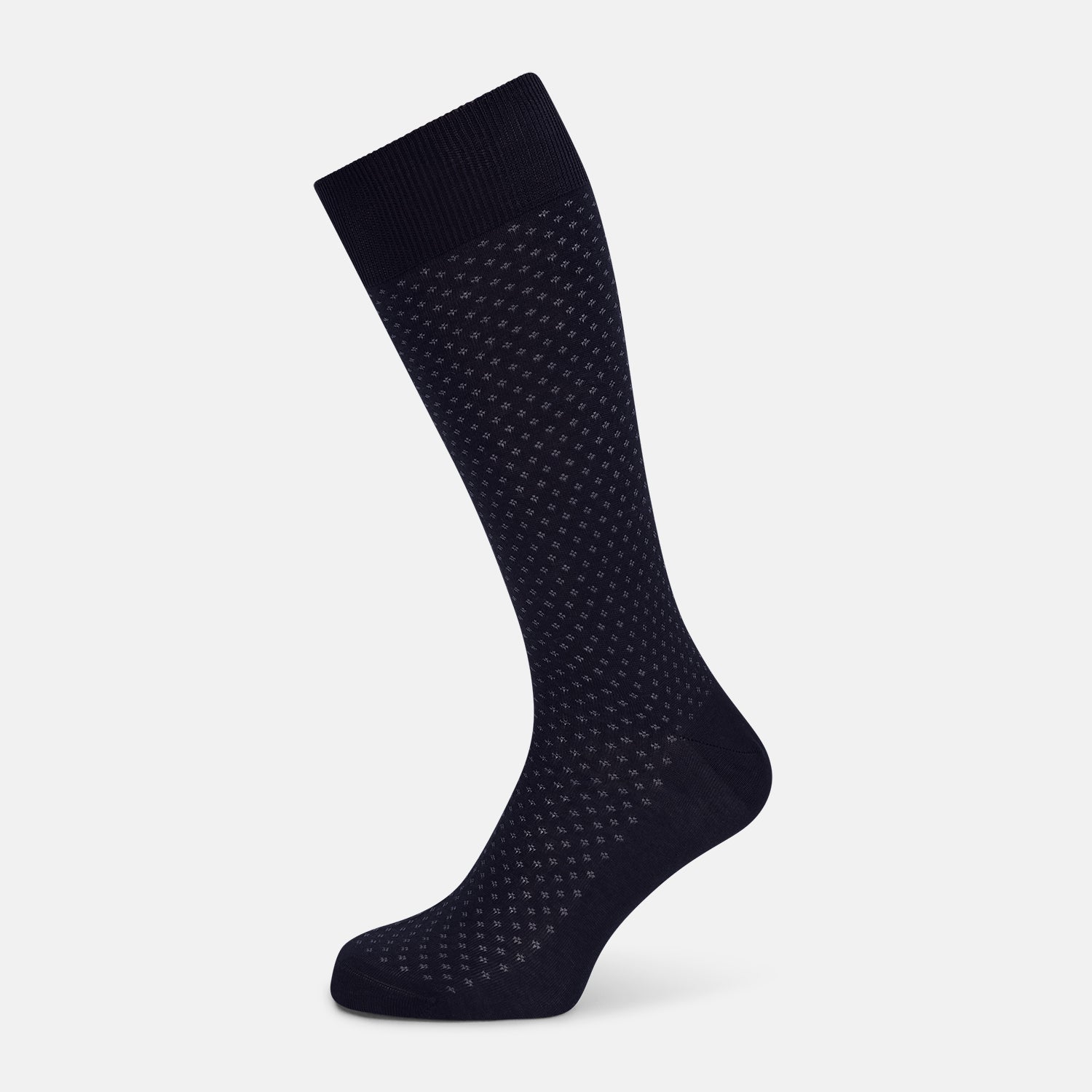 View 1 of product The Turnbull & Asser Midnight Motif Mid-Length Sock is a single black knee-high made from mercerised Egyptian cotton, featuring a subtle dotted pattern, showcased on a plain white background.