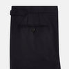 View 9 of product The Turnbull & Asser Long Navy Single Breasted Suit, shown on a white background, features a blazer with notch lapels and matching tailored trousers—ideal for formal occasions.