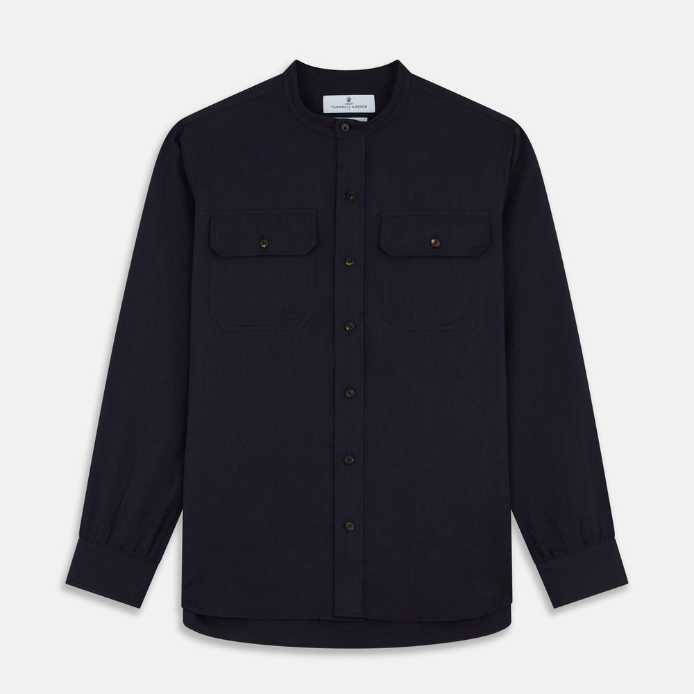 The Turnbull & Asser Navy Military Weekend Fit Shirt features a stand collar, black buttons, dual chest flap pockets, and 1-button cuffs in Italian cotton-wool, shown laid flat on a white background.
