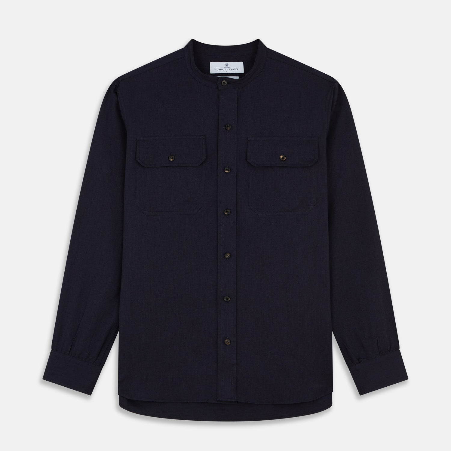 View 1 of product The Turnbull & Asser Navy Military Weekend Fit Shirt features a stand collar, black buttons, dual chest flap pockets, and 1-button cuffs in Italian cotton-wool, shown laid flat on a white background.