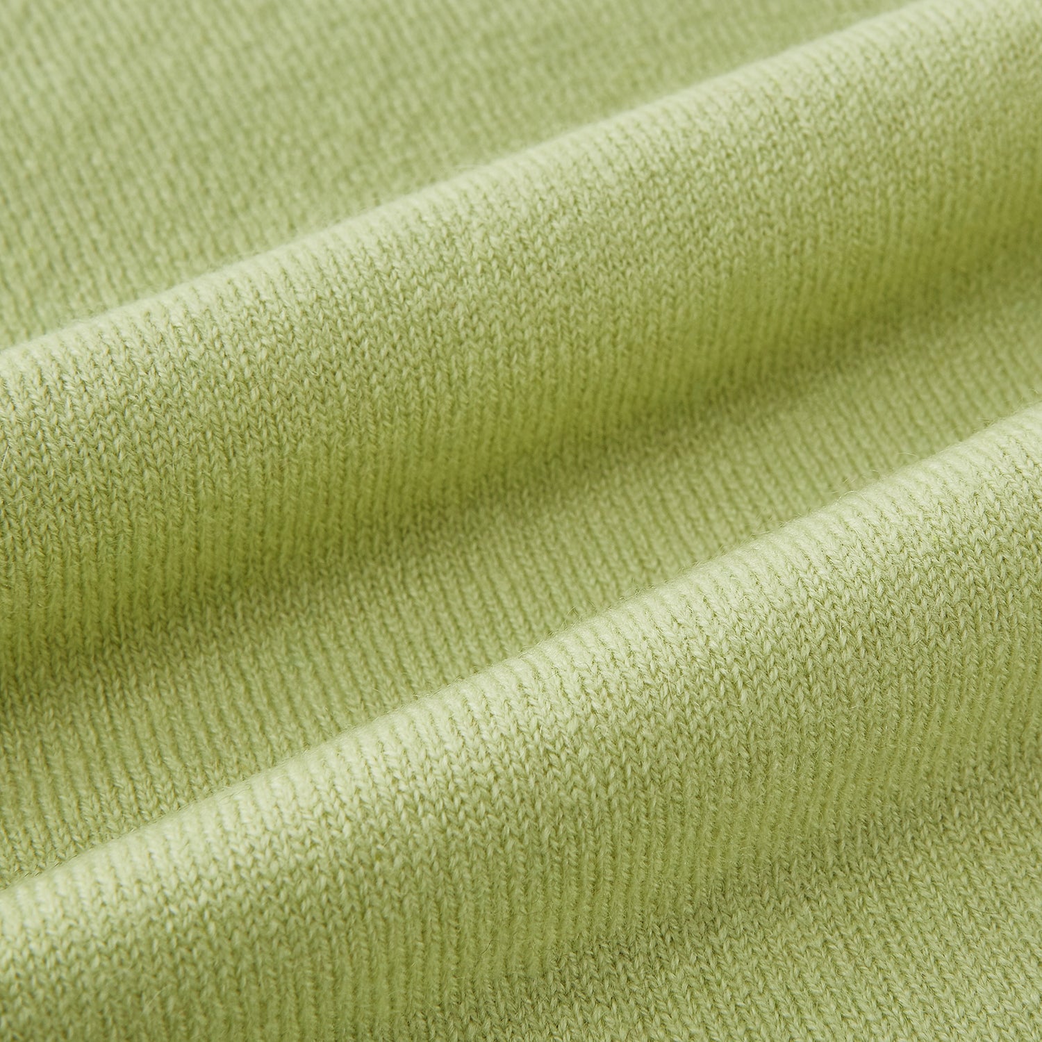 View 3 of product The Plain Canary Yellow Cashmere Knitted Scarf from Turnbull & Asser is a soft, premium accessory, elegantly draped against a white background—an essential addition to any wardrobe.