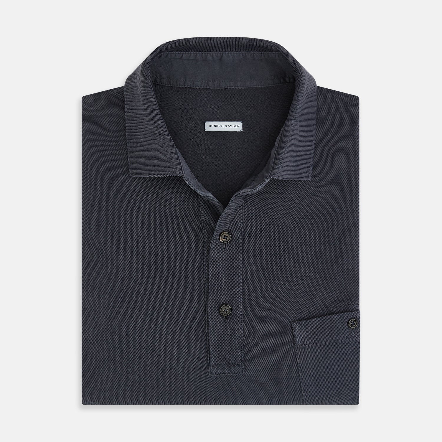 View 4 of product The Turnbull & Asser Charcoal Polo Shirt is a short-sleeve, soft cotton jersey top with a collar, three-button placket, and a left chest pocket, shown on a plain white background.
