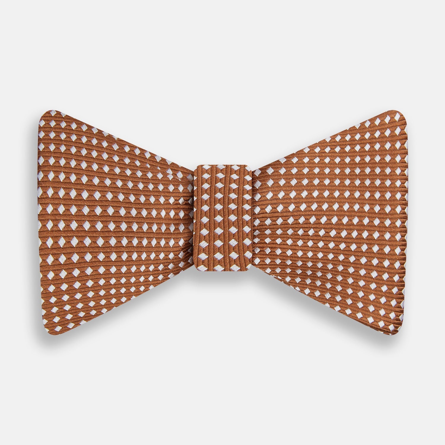 View 1 of product The Turnbull & Asser Brown and White Diamond Silk Bow Tie features a diamond pattern, ideal for formal occasions, showcased on a white background.