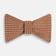 The Turnbull & Asser Brown and White Diamond Silk Bow Tie features a diamond pattern, ideal for formal occasions, showcased on a white background.