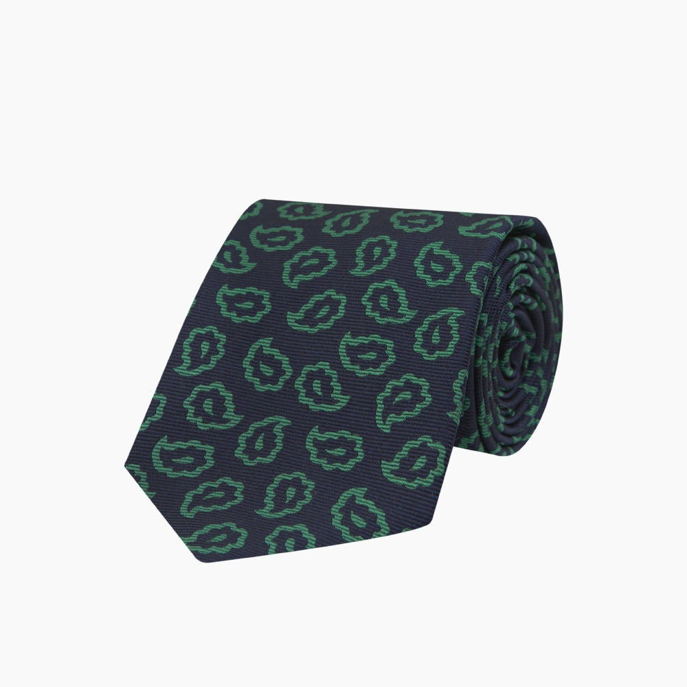 The Turnbull & Asser Navy and Green Petal Paisley Silk Tie is a stylish accessory, featuring timeless paisley motifs on silk, making it an elegant addition to any wardrobe.