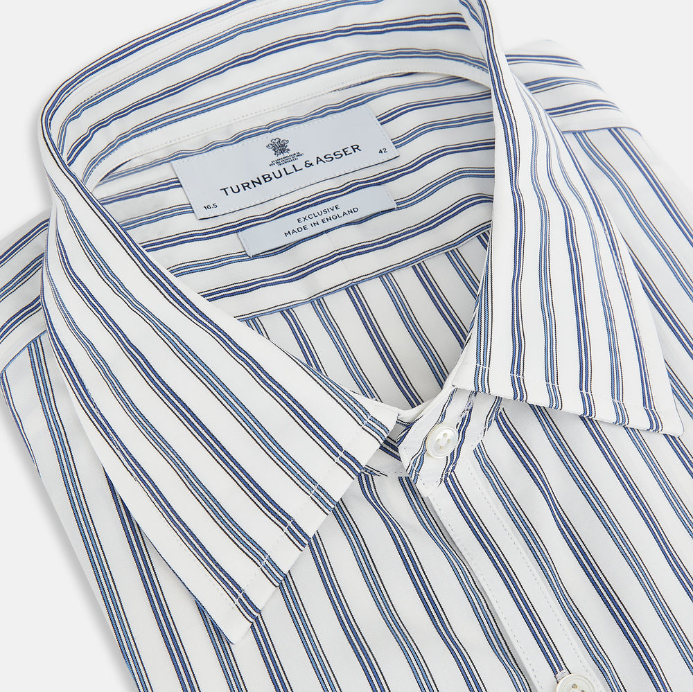 The Sapphire Blue Multi Track Stripe Westminster Shirt by Turnbull & Asser features a turnbull collar and vertical stripes, elegantly displayed flat against a white background—an ideal example of British craftsmanship.
