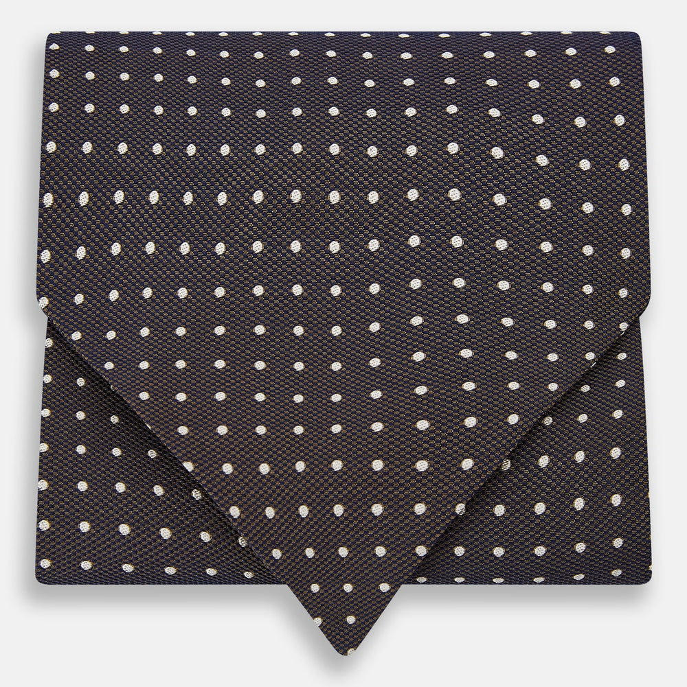 The White and Brown Micro Dot Silk Cravat from Turnbull & Asser adds refined style to any outfit with its subtle dotted pattern and luxurious silk fabric.