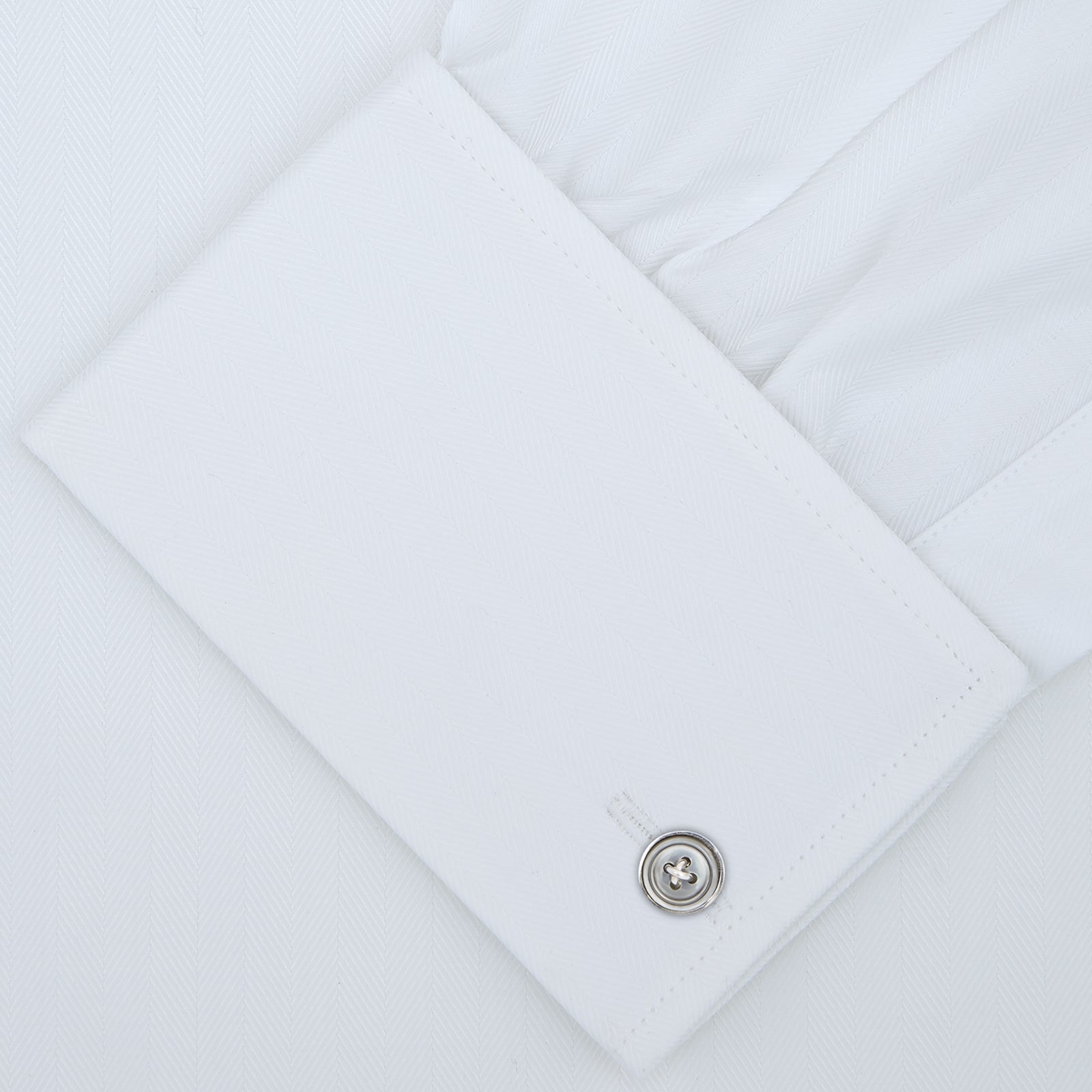 View 2 of product A White Self-On-Self Herringbone Sea Island Quality Cotton Shirt with Regent collar and double cuffs by Turnbull & Asser, displayed against a light gray background.