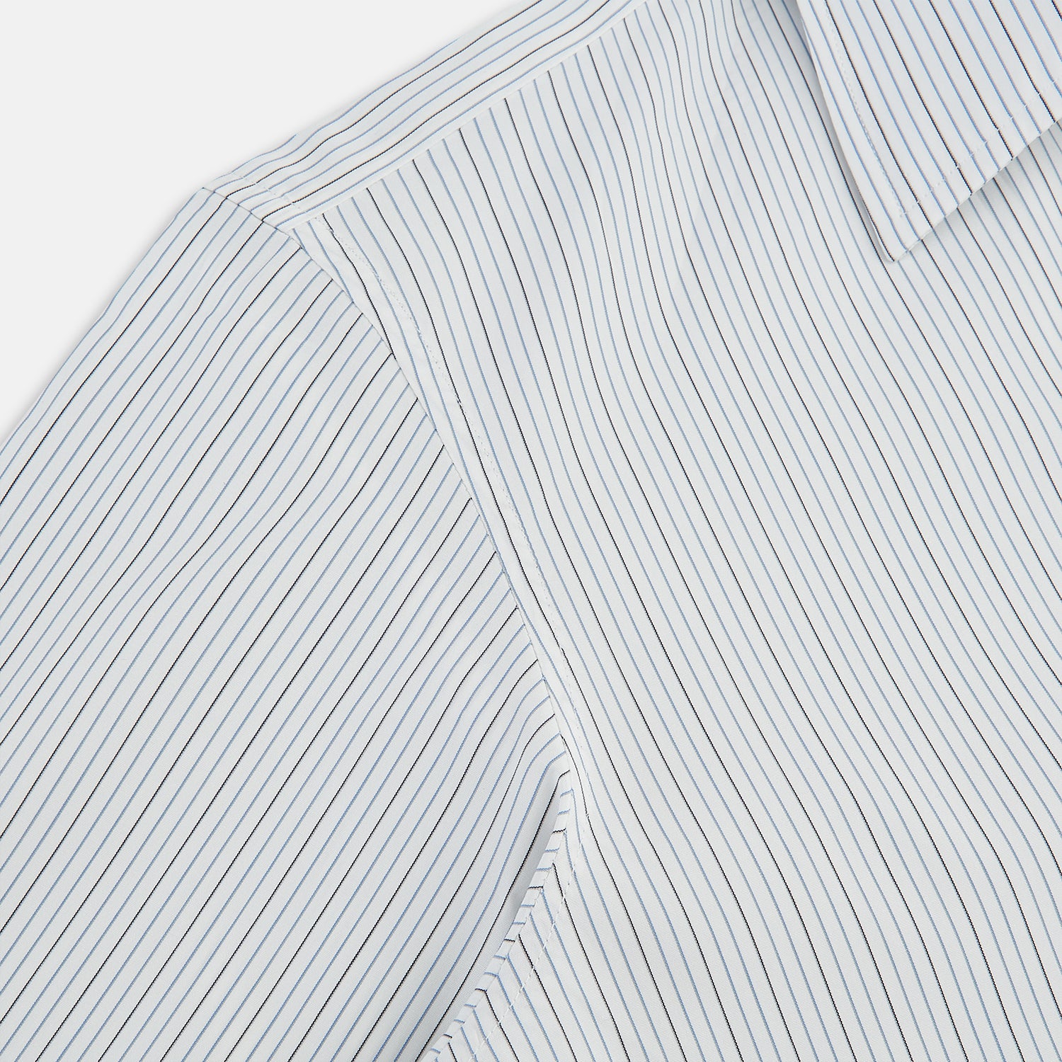 View 6 of product The Turnbull & Asser Grey and Blue Pinstripe Westminster Shirt features fine stripes, a classic collar, and buttoned cuffs—showcasing signature British craftsmanship against a plain white backdrop.