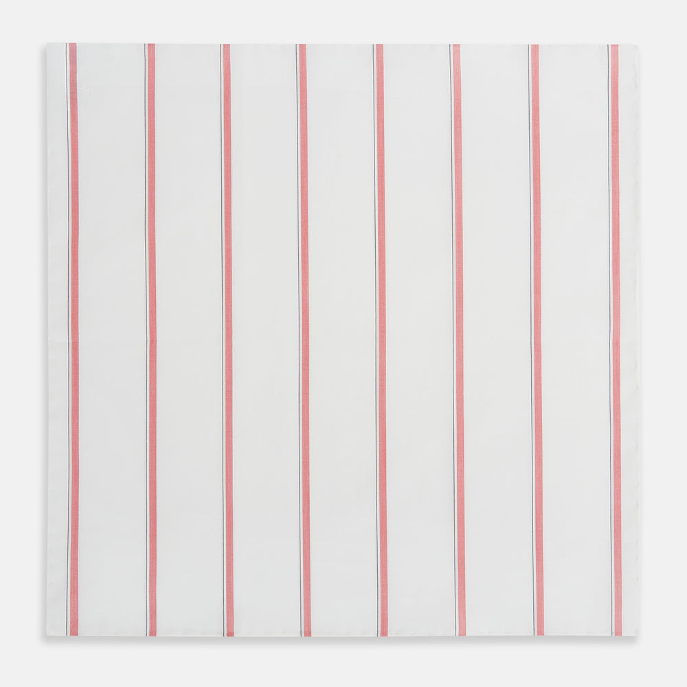 The Turnbull & Asser Coral Track Stripe Hand-Rolled Handkerchief features evenly spaced vertical coral stripes bordered by thin gray lines, finished with hand-rolled edges and displayed neatly folded on a white background.