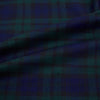 View 8 of product The Turnbull & Asser Black Watch Tartan Windsor Shirt is a long-sleeve, button-up shirt with a dark green and navy tartan pattern, white buttons, collar, and curved hem—showcasing British craftsmanship on a plain white background.