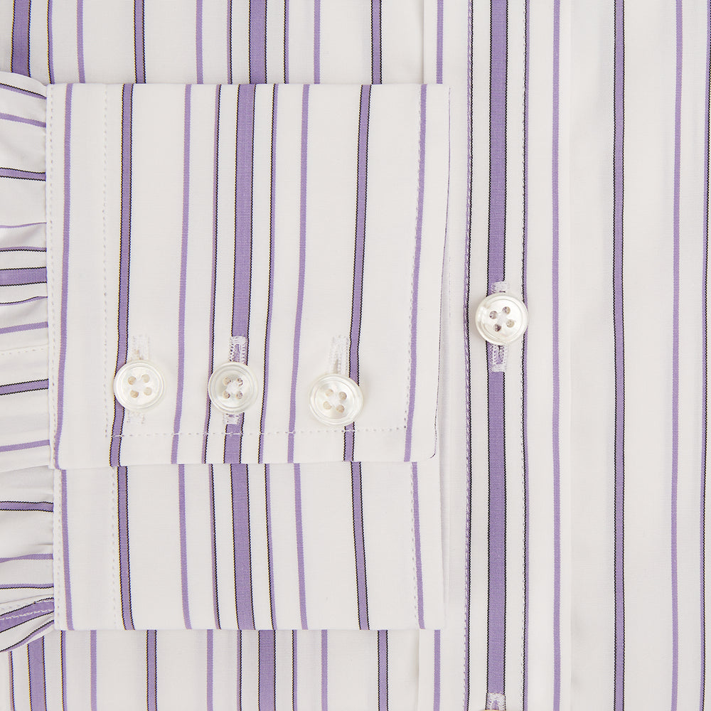 The Purple Multi Stripe Mayfair Shirt by Turnbull & Asser is a long-sleeve, collared button-up featuring vertical blue and purple stripes on white, ideal for formal occasions. The shirt is neatly displayed flat against a white background.