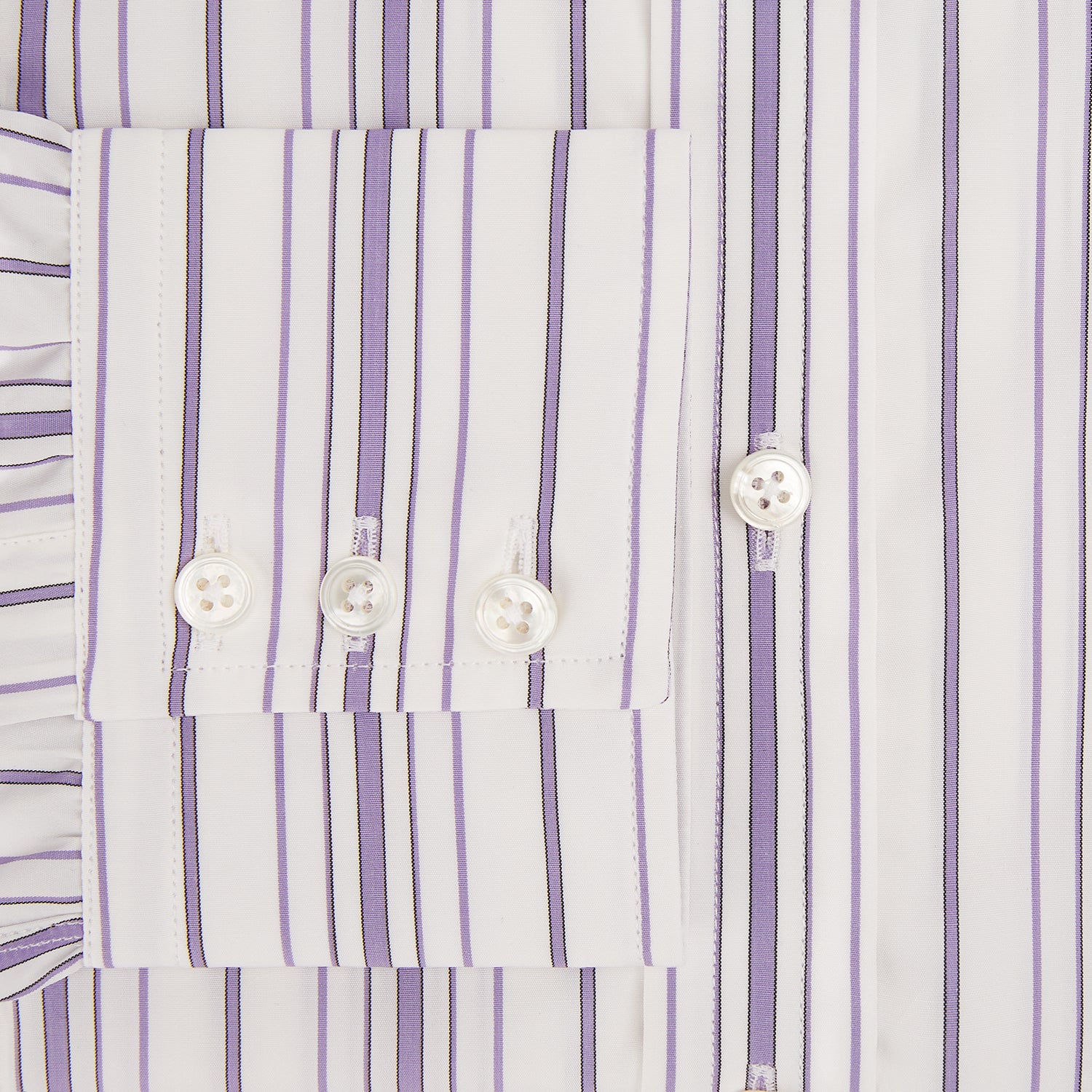 View 4 of product The Purple Multi Stripe Mayfair Shirt by Turnbull & Asser is a long-sleeve, collared button-up featuring vertical blue and purple stripes on white, ideal for formal occasions. The shirt is neatly displayed flat against a white background.