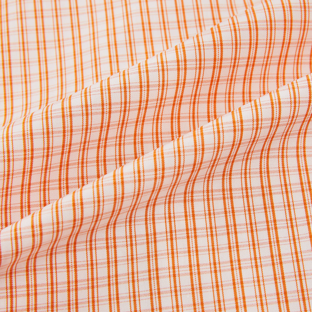 The Turnbull & Asser Orange Micro Check Mayfair Shirt, a long-sleeve button-up with a classic T&A collar and white-orange micro check pattern, is shown neatly laid flat on a white background.