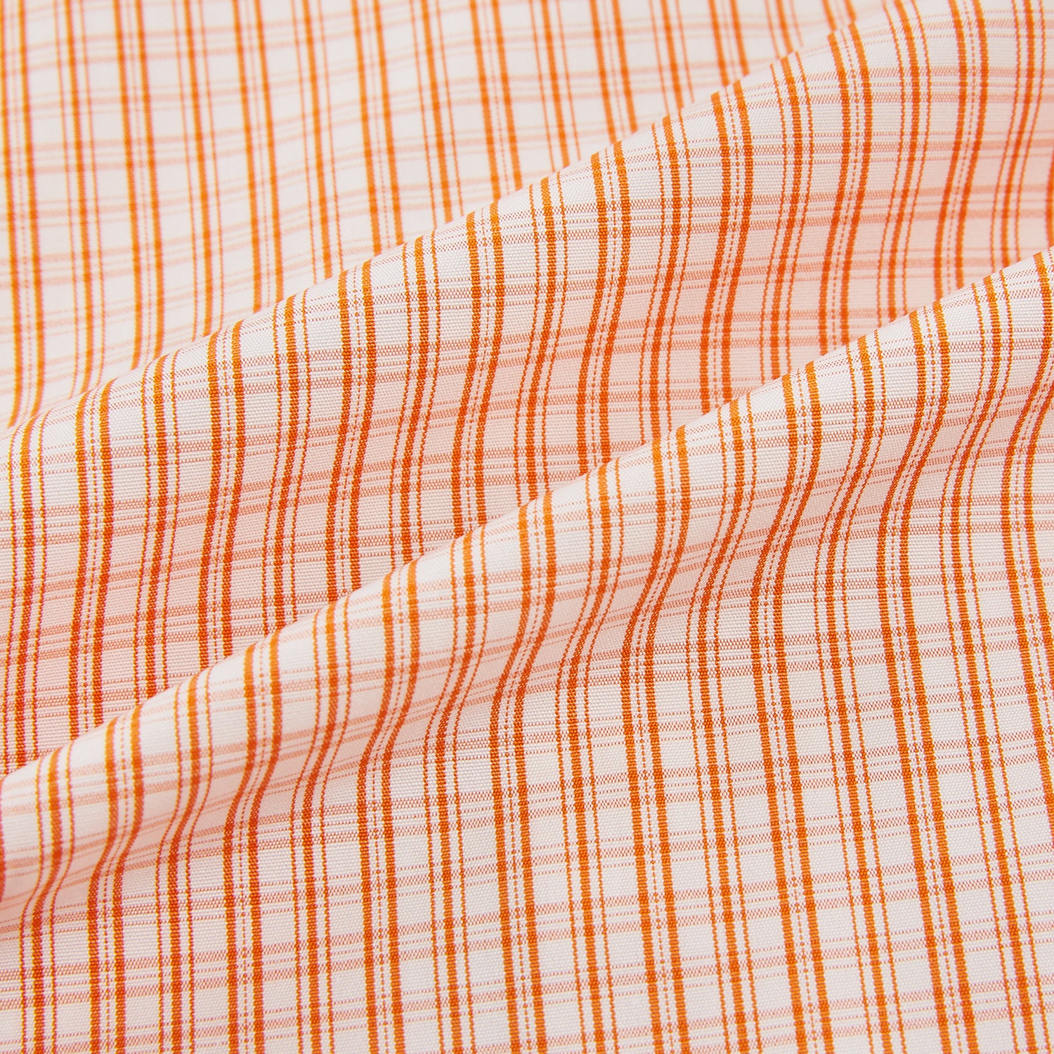 View 6 of product The Turnbull & Asser Orange Micro Check Mayfair Shirt, a long-sleeve button-up with a classic T&A collar and white-orange micro check pattern, is shown neatly laid flat on a white background.
