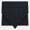 View 1 of product The Green Micro Dot and Navy Silk Cravat by Turnbull & Asser features fine green micro dots on navy silk, adding a refined touch to formalwear. Pair it with a matching pocket square for a cohesive, polished look.