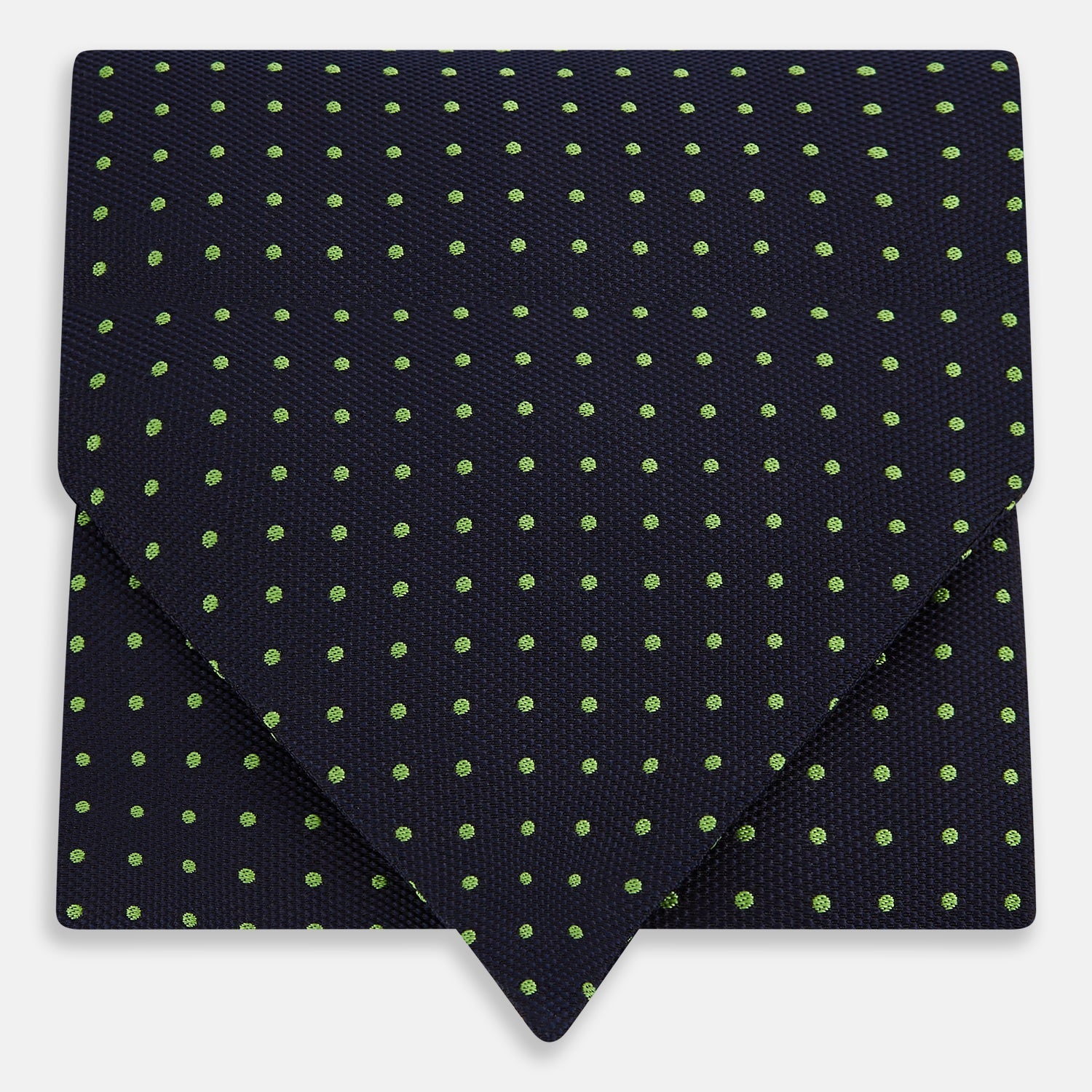 View 1 of product The Green Micro Dot and Navy Silk Cravat by Turnbull & Asser features fine green micro dots on navy silk, adding a refined touch to formalwear. Pair it with a matching pocket square for a cohesive, polished look.