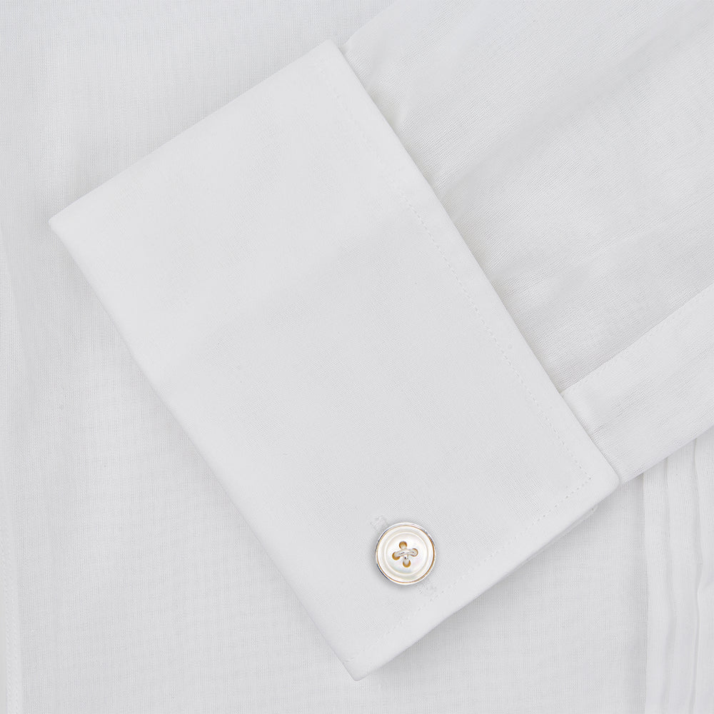 The Die Another Day Inspired Voile Dress Shirt by Turnbull & Asser features a white pleated front, button-down closure, and classic collar—laid flat on white to showcase its timeless James Bond style.