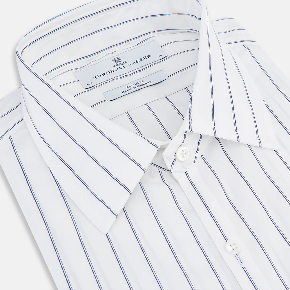 The Dark Navy Double-Pinstripe Westminster Shirt by Turnbull & Asser, featuring a Turnbull collar and cuffed sleeves, is displayed laid flat on a plain white background, highlighting its British craftsmanship.