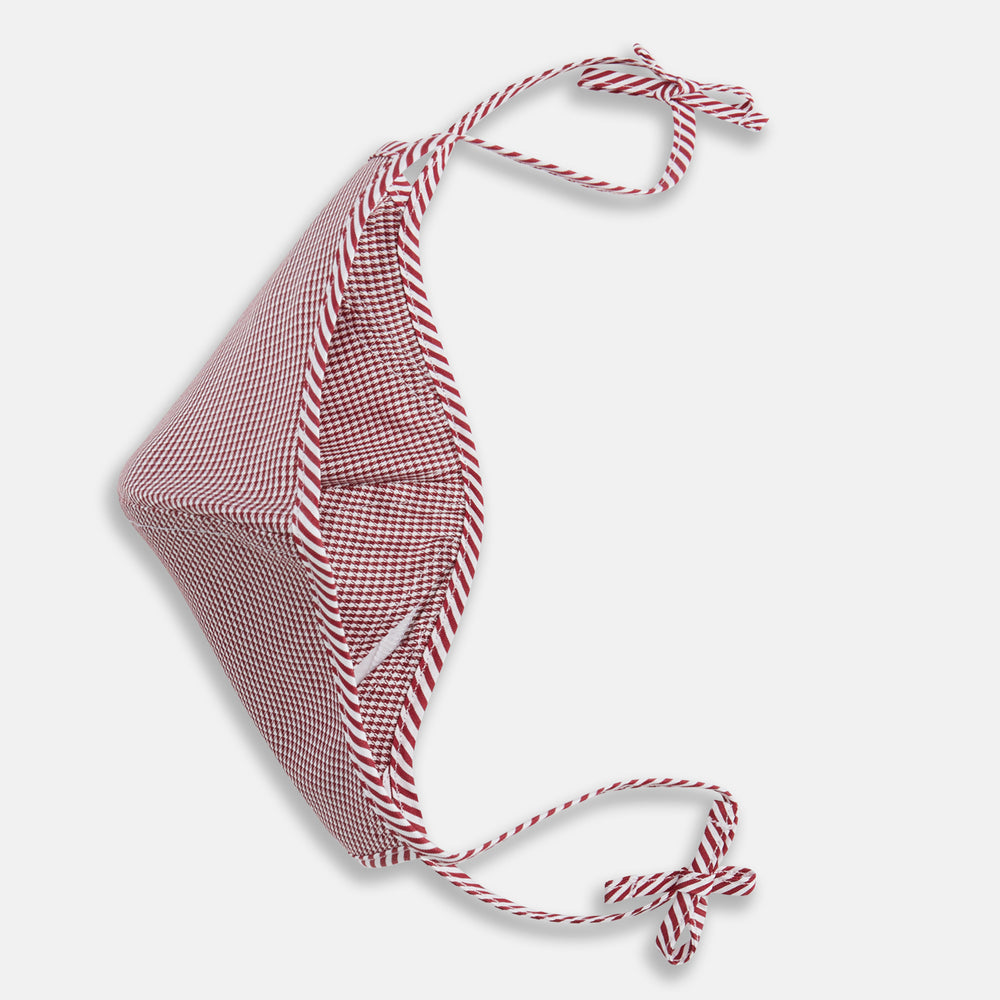 The Turnbull & Asser Burgundy Check Commuter Mask comes with 3 Viroformula™ filters. It features a check pattern, adjustable ear straps, and is displayed on a plain white background.