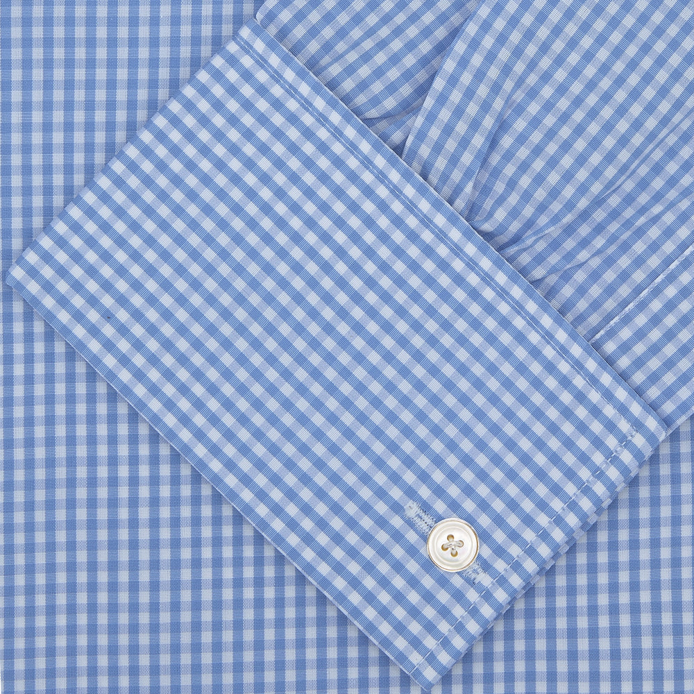The Turnbull & Asser Blue and White Check Shirt features a T & A collar, double cuff, small check pattern, and white buttons—crafted from soft cotton for timeless style.
