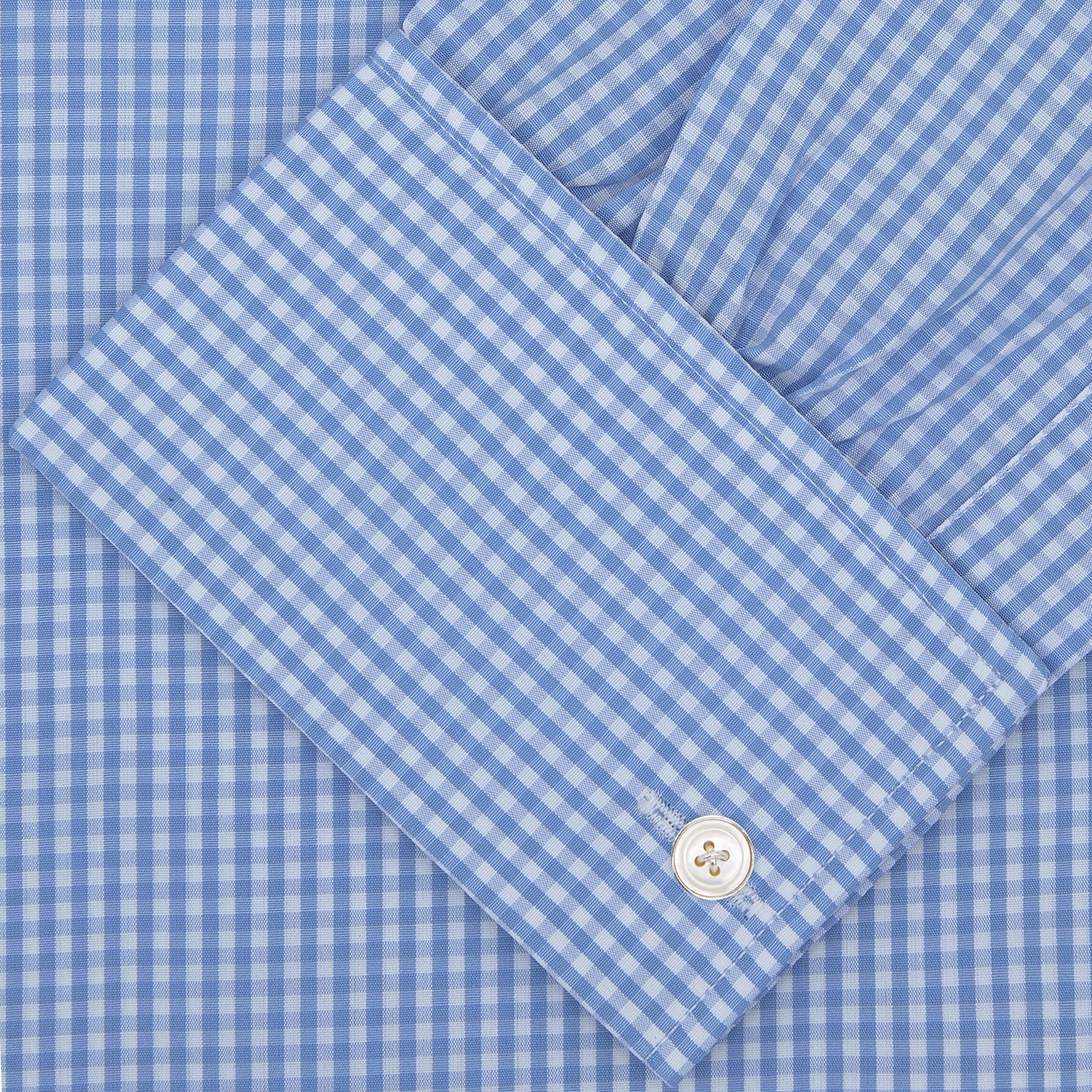 View 2 of product The Turnbull & Asser Blue and White Check Shirt features a T & A collar, double cuff, small check pattern, and white buttons—crafted from soft cotton for timeless style.