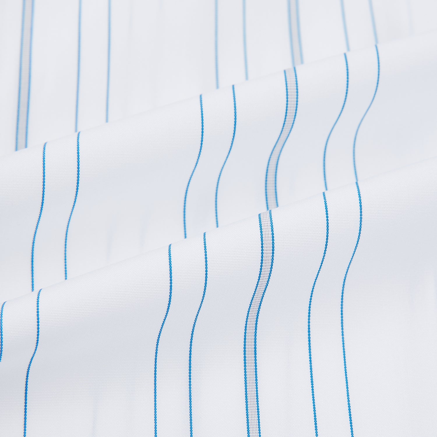 View 6 of product The Turnbull & Asser Pale Blue Multi Stripe Shirt features thin vertical stripes, a contrast collar, and double cuffs, displayed on a plain light background.