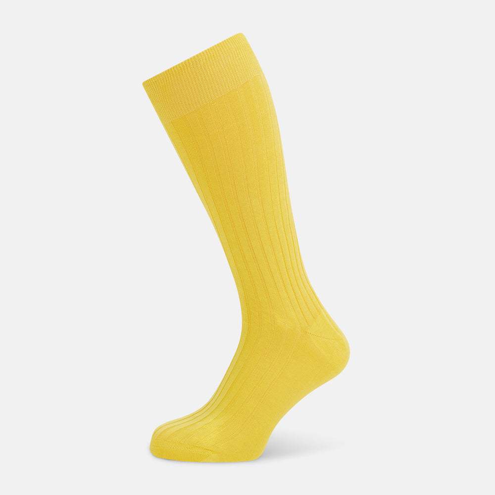 A single Charteuese Lemon Mid-Length Sock by Turnbull & Asser, knee-high and bright yellow with a ribbed Egyptian cotton texture, is displayed upright against a plain white background.