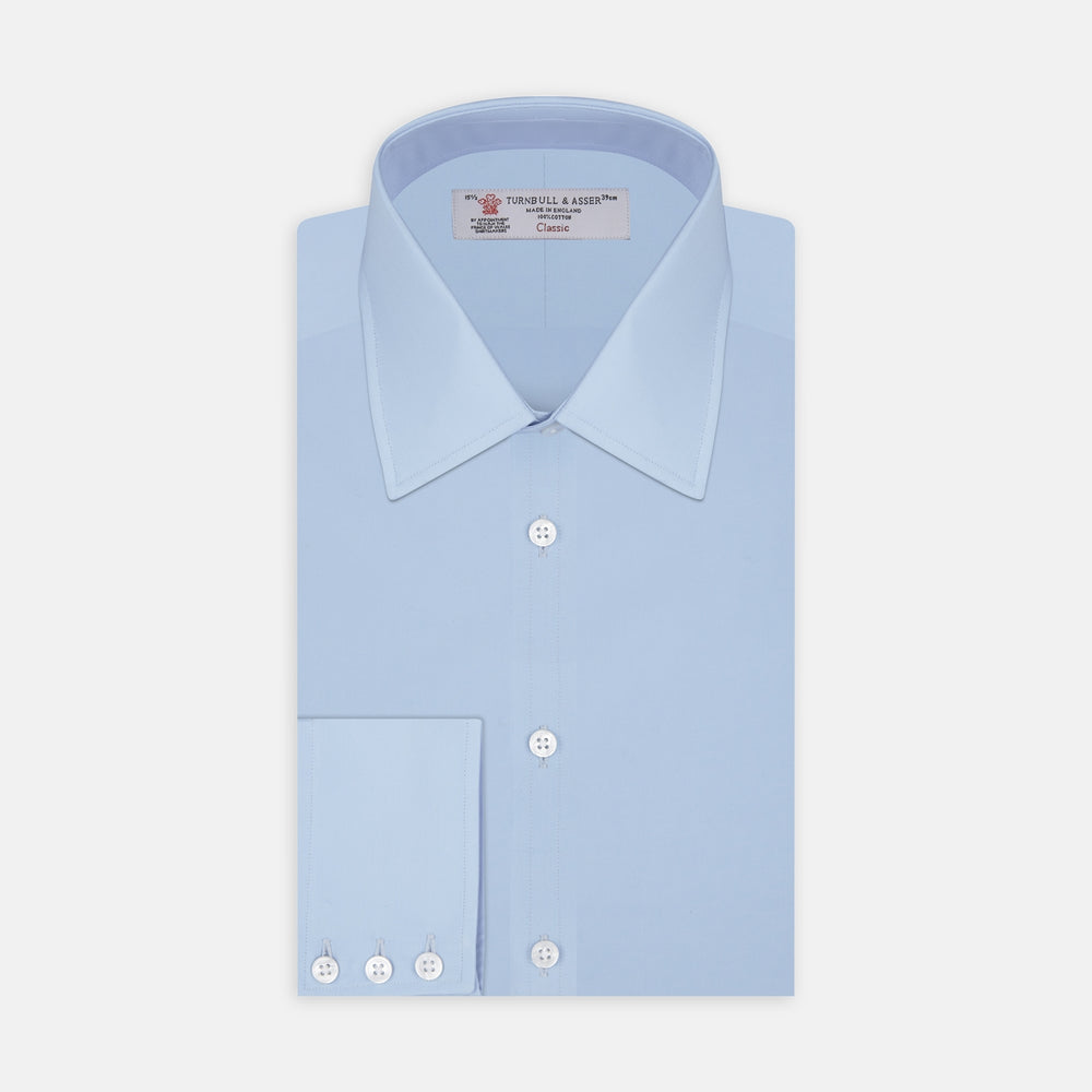 A Light Blue Cotton Shirt with a T&A collar and 3-button cuffs by Turnbull & Asser is displayed on a plain white background, ideal for pairing with a navy suit.