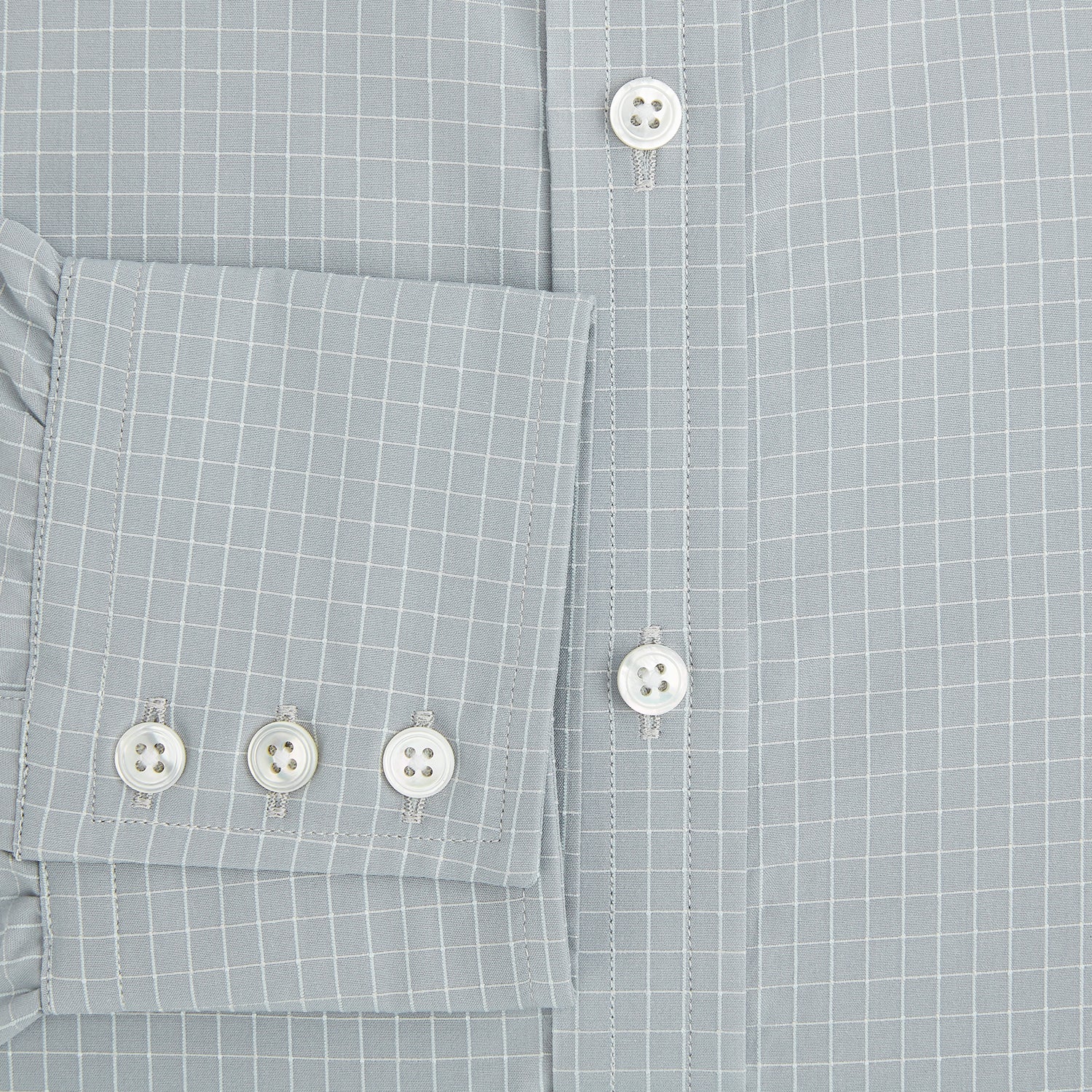 View 4 of product Turnbull & Asser Pale Blue Fine Check Mayfair Shirt—a long-sleeve button-up with classic collar, buttoned cuffs, white buttons, and a subtle check pattern in sanforised cotton—displayed on a white background.