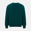 View 3 of product The Turnbull & Asser Moss Green Cashmere Round Neck Jumper, shown on a plain white background, is men's knitwear with long sleeves and a classic design featuring ribbed cuffs, neckline, and hem for timeless style.