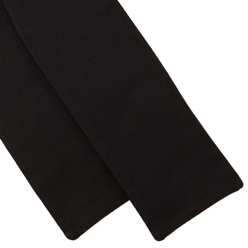 The Turnbull & Asser Black Batwing Satin Bow Tie features a smooth, matte finish and is neatly tied on a plain white background—ideal for formal occasions.