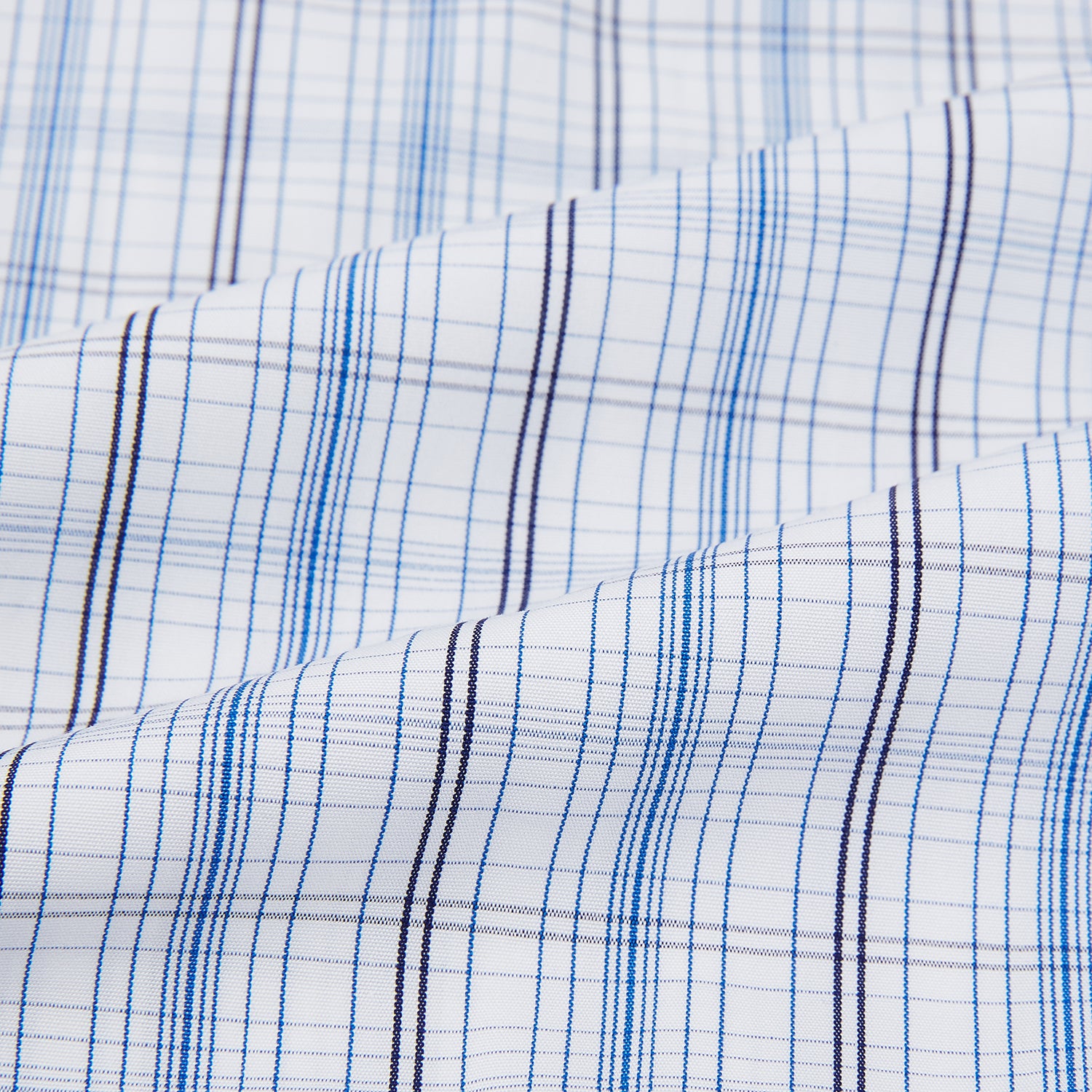 View 6 of product The Turnbull & Asser Blue and Navy Multi Check Mayfair Shirt features a classic T&A collar and long sleeves, with a blue multi-check pattern on white, neatly displayed against a plain white background.