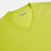 View 2 of product The Lemon Green Cashmere V-neck Jumper by Turnbull & Asser features ribbed cuffs and hem—an essential long sleeve knitwear piece, shown against a white background.