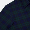 View 6 of product The Turnbull & Asser Black Watch Tartan Windsor Shirt is a long-sleeve, button-up shirt with a dark green and navy tartan pattern, white buttons, collar, and curved hem—showcasing British craftsmanship on a plain white background.