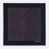 View 3 of product The Navy and Pink Stripe Silk Pocket Square by Turnbull & Asser features thin pink stripes, a geometric border, hand-rolled edges, and "TURNBULL & ASSER HAND PRINTED IN ENGLAND" printed in white.
