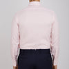 View 3 of product A Pink Herringbone Superfine Cotton Shirt by Turnbull & Asser, featuring a T&A collar and 3-button cuffs, is neatly folded with the inner collar label visible and white buttons, set against a plain white background.