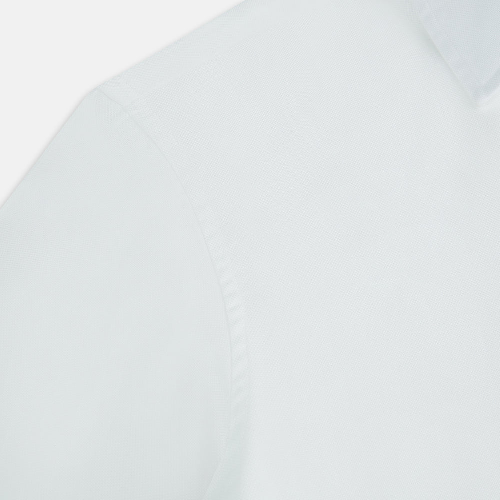 The Turnbull & Asser White Royal Oxford Cotton Windsor Shirt features a Turnbull open collar, long sleeves, 3-button cuffs, and a straight hem, shown against a plain white background.